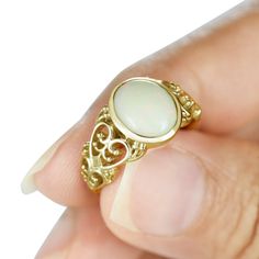 Heart Filigree Opal Ring - White Opal Ring, Anniversary Gold Ring, Large Opal Ring, 14K Rose Gold Ring, White Gold Opal Ring, Yellow Gold Opal Ring This bold and chunky opal signet ring is going to add sophisticated glam to your hand and will add impact to every single outfit you wear. A fabulous stand-alone piece that is so versatile you'll want to wear it every day. White opals stands for purity, love, goodness and nurturing. Of course, you are all of the above! If you're zodiac sign is taurus Heirloom Yellow Gold Opal Ring As A Gift, Heirloom Yellow Gold Opal Ring Gift, Gold Heart Ring With Gemstone, Gold Heart Ring With Oval Gemstone, Gold Opal Birthstone Ring For Anniversary, Exquisite Yellow Gold Opal Ring Gift, Elegant Gold Heart Ring With Birthstone, Heirloom Oval Heart Ring Gift, Yellow Gold Opal Ring Hallmarked As Gift