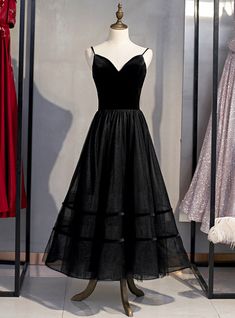 This irresistible black velvet tulle prom dress is a perfect option to dazzle on your prom night. The sweetheart neckline is hung with the help of two spaghetti straps that add to the beauty of the gown. The back of the gown divides into a network of straps covering the backless bodice with ultimate artistic fashion. Visible seaming on the tight fitted corset bodice enhances the sexy feel of the donner as it highlights the contours of the body at all the right places. The skirt oozes out of the tight fitted waistline and goes to the tea length with reasonable flare giving the feminine romantic feel! Backless Long Sleeve Wedding Dress, Long Sleeve Wedding Dress Backless, Crystal Prom Dress, Tea Length Prom Dress, Black Lace Prom Dress, Tiered Prom Dress, Tea Length Tulle, Backless Long Sleeve, White Ball Gowns