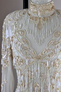 White Hand Embellished Formal Gown, Glamorous White Wedding Dress For Reception, White Hand Embellished Wedding Dress, Hand Embellished White Wedding Dress, Elegant Cream Wedding Dress For Reception, Traditional Beaded Wedding Dress, Elegant White Hand Embellished Wedding Dress, Evening Wedding Dress With Intricate Embroidery, Elegant Embellished Festive Wedding Dress