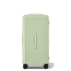 a light green suitcase with wheels and handles on the front, against a white background