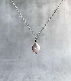 Amazing dainty necklace with baroque pearl pendant. Explore ways to layer this piece or wear it on its own for a minimal look. Dainty, minimal, stylish, lightweight choker. Great gift idea for women (wife, girlfriend, mom, sister...). Please select your necklace size from a drop-down menu from 14' (35 cm) to 24' (60 cm). To get the right necklace size for you: * Take a string or a piece of ribbon etc. * Wrap around your neck to the desired spot for wearing your necklace * Hold or mark that spot Feminine Pearl Charm Pendant Necklace, Minimalist Pearl Charm Pendant Necklace, Minimalist Baroque Pearl Necklace With Pendant, Minimalist Pearl Charm Necklace With Round Pendant, Delicate Baroque Pearl Necklace With Delicate Chain, Delicate Baroque Pearl Necklace, Everyday Baroque Pearl Necklace, Minimalist Teardrop Pearl Chain Necklace, Minimalist Pearl Charm Chain Necklace