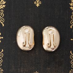 When we first came across this sweet pair of gold clip-on orbs, we knew we had to have 'em! Sweet and chic, these babies remind us of the goodies found in jewelry boxes of a cosmopolitan lady in the 1980's. They're bold and present, but hollow in make to allow for total comfort when worn. Perfect for daily wear, whether you're going for a glam gold look or just dressing up your jeans and T shirt. 14kt yellow gold Measures: 20.76mm L & 14.63mm W 7.7 grams Vintage Gold Plated Clip-on Earrings For Formal Occasions, Vintage Yellow Gold Plated Clip-on Earrings, Metal Clip-on Earrings With Polished Finish For Gift, Polished Metal Clip-on Earrings For Gift, Polished Metal Clip-on Earrings As Gift, Classic Metal Clip-on Earrings For Evening, Vintage Gold-plated Clip-on Earrings, Vintage Gold Plated Clip-on Earrings, Vintage Yellow Gold Clip-on Earrings For Party