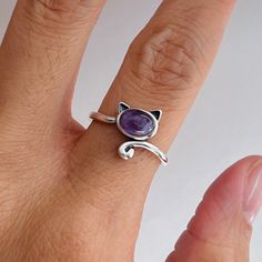 925 sterling silver  Stone: amethyst  Finish: oxidized  Height: 12.1 mm Can be worn: on multiple fingers and midi ring  Symbolizes: power, strength, purity, courage, rebirth, and resurrection Dainty Amethyst Birthstone Ring In Sterling Silver, Dainty Sterling Silver Amethyst Birthstone Ring, Dainty Silver Amethyst Ring Gift, Adjustable Silver Amethyst Ring, Adjustable Silver Amethyst Ring Fine Jewelry, Silver Sterling Silver Amethyst Ring Gift, Adjustable Silver Amethyst Ring In Fine Jewelry, Dainty Silver Amethyst Rings, Adjustable Silver Amethyst Ring In Sterling Silver