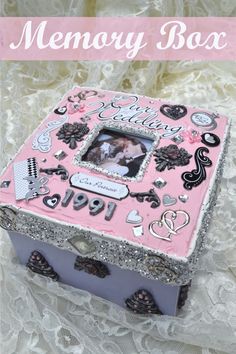 a pink and silver box with pictures on it