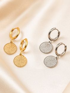 Discover the allure of Ancient Greece with our Greek Phaistos Disc hoop Earrings! Made of stainless steel, these gold or silver Phaistos coin earrings make a perfect gift for her. Hoop Diameter : 15 mm Hoop Thickness : 2.4 mm  Phaistos Disc Diameter : 1.4 cm or 1.6 cm or 1.8 cm or 2.5 cm. Length :  Diameter 1.4 cm is :  3 cm Diameter 1.6 cm is :  3.3 cm Diameter 1.8 cm is :  4 cm Diameter 2.5cm is :  4.3 cm This symbol is called "Disk of Phaistos". --------------- {The disk of Phaistos is found Silver Circle Earrings Tarnish Resistant, Silver Tarnish-resistant Circle Earrings, Silver Plated Brass Hoop Earrings, Gold Plated Silver Huggie Earrings, Tarnish Resistant Gold Plated Silver Hoop Earrings, Silver Tarnish Resistant Hoop Earrings In Brass, Silver Huggie Earrings In Brass, Stainless Steel Huggie Earrings As Gift, Round Stainless Steel Huggie Earrings As Gift