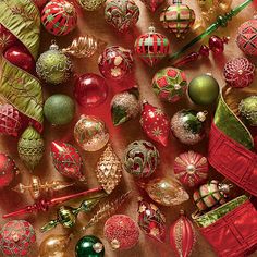 many christmas ornaments are arranged on a table