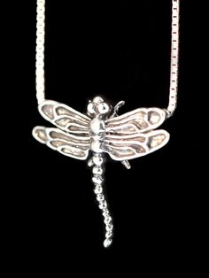 This beautifully detailed dragonfly pendant is cast in solid sterling silver. It has a 1" wing span and the chain slips through two hidden bails positioned behind each wing tip. Take flight!All Marty Magic Charms and Pendents include an 18 inch (46cm) box chain. If you would prefer a different length of chain please feel free to contact us.This item usually ships the same or next business day.All Marty Magic Jewelry is packaged in a beautiful purple box, embossed with the gold foil Marty Magic d Adjustable Sterling Silver Dragonfly Necklace, Sterling Silver Dragonfly Necklace, Bug Necklace, Insect Necklace, Magic Jewelry, Magic Charms, Dragonfly Wings, Dragonfly Jewelry, Dragonfly Charm