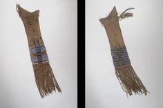 two pieces of cloth with fringes hanging from the side and on top of each other