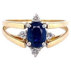 Vivid blue sapphire or a sparkling white cluster of diamonds, it's your choice. This fabulous flip ring presents both looks on demand. Offering a .75 carat (6.5 x 4mm) oval faceted sapphire accented with four round diamonds and on the reverse flip, a cluster of ten round H/VS diamonds, .46 carat total weight. Making this possible is a unique fourteen karat yellow gold 14K double ring shank that is hinged at the ring's head and easily flips to change to your desired style. In ring size 8.5. Resiz Oval Sapphire Ring With Vvs Clarity, Oval Diamond Cut Sapphire Ring Fine Jewelry, Oval Sapphire Diamond Ring With Accents, Oval Sapphire Ring With Vvs Clarity In 14k Gold, Oval Sapphire Ring With Diamond Accents, Fine Jewelry, Oval Sapphire Diamond Ring With Diamond Cut, Oval Sapphire Ring With Diamond Accents For Anniversary, Oval Sapphire Ring With Diamond Accents In Yellow Gold, Oval Yellow Gold Sapphire Ring With Diamond Accents