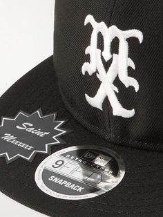 SAINT Mxxxxxx has collaborated with New Era on this baseball cap, a brand that has specialised in the category for about a century. It’s made from twill in the brand's '9FIFTY' profile and embroidered with a mascot on the front. Classic Fitted Hat With Logo Patch For Streetwear, Classic Six-panel Fitted Hat For Streetwear, Six-panel Fitted Hat For Baseball Season, Black Logo Baseball Cap Six-panel, Black Logo Baseball Cap, Logo Baseball Cap For Streetwear, Classic Snapback Hat With Logo Patch For Streetwear, Classic Snapback Hat For Streetwear, Classic Baseball Cap With Embroidered Logo For Streetwear