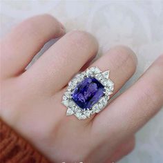 For Sale on 1stDibs - This stunning ring has been meticulously crafted from 18-karat gold. It is hand set with 14.64 carats tanzanite and illuminated with 3.0 carats of sparkling Sapphire Wedding Rings, Tanzanite Diamond, Sapphire Wedding, Diamond Wedding Rings, White Gold Rings, Cocktail Rings, Vintage Rings, Sapphire Ring, Gold Rings