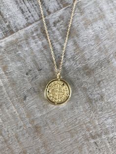 24k gold filled rustic coin charm with black crystal detail on 14k gold filled chain. Available on 16, 18 or 21 inch length chain. Recycled Gold Medallion Coin Pendant, Brass Coin Pendant Jewelry, Tarnish Resistant 14k Gold Filled Medallion Jewelry, Recycled Gold Coin Pendant Amulet Jewelry, Recycled Gold Amulet Jewelry With Coin Pendant, Amulet Style Coin Pendant Jewelry In Recycled Gold, Amulet Style Jewelry With Coin Pendant In Recycled Gold, Tarnish Resistant 14k Gold Filled Medallion Charm Necklace, 14k Gold-filled Yellow Gold Coin Necklace