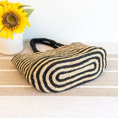 IN STOCK FAST SHIPPING FROM LOS ANGELES Take your beach style to the next level with our Elena Handbags Raffia Summer Beach Striped Straw Tote Bag! This bag features a classic and stylish striped design, perfect for any summer outing. Made with durable raffia material, it's the ideal choice for all your beach essentials. (No more sandy bags!) Natural Raffia Straw Handmade Unlined Size: 10"H x 16"W Handle drop length: 7" Designer Style ID: 8695 Straw Tote Bag, Raffia Bag, Straw Bags, Straw Tote, Beach Essentials, Denim Bag, Shoulder Tote Bag, Designer Style, Knitted Bags