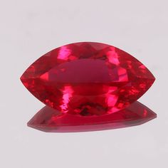 a large red diamond sitting on top of a table