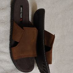 Leather Uppers With Rubber Soles. Just Slip Feet In And Go. New Never Wore. Mn. Sz.41 Casual Flat Flip Flops With Ortholite Insole, Casual Brown Slides For Outdoor, Casual Brown Outdoor Slides, Brown Textured Footbed Flip Flops For Outdoor, Brown Textured Flip Flops For Outdoor, Brown Slip-on Flip Flops For Outdoor, Casual Adjustable Slippers With Ortholite Insole, Outdoor Leather Footbed Slip-on Flip Flops, Casual Brown Outdoor Slippers