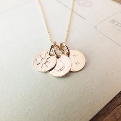 Designed for the person who means everything to you. Three tiny charms feature a sun, moon, and a sky of stars, which together make the perfect gift for your love. Sky Of Stars, Moon And Stars Necklace, Moon Stamp, Stamp Jewelry, Tiny Charms, Moon And Star Necklace, Appreciate Everything, Stars Necklace, Sea Necklace