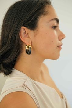 PRODUCT DESCRIPTION If you are a fan of Complete. Studio. You would know Amber Hoop Earrings are our all-time best sellers. Same style, but a brand new color is now landed as a lot of our customers request black! Elevate your look with the sleek sophistication of our Inkwell Kira Earrings. Statement Hoop Earrings Water Resistant 18k Gold-plated on High-quality brass Acrylic 3.6cm in height 3.2cm in width Weight: 12-14g for each Read our full Jewellery Care Guide here Read our Sizing Guide here Chic Black Earrings With Black Enamel, Trendy Black Clip-on Earrings As Gift, Modern Black Single Earring, Trendy Black Everyday Earrings, Trendy Black Pierced Hoop Earrings, Trendy Black Clip-on Earrings, Black Drop Earrings For Everyday, Everyday Black Drop Earrings, Black Drop Clip-on Earrings With Ear Wire