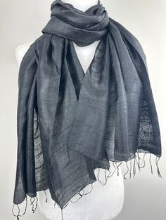 "This is an all season light weight Thai Raw Silk  Shawl. This versatile shawl can be used to dress up an outfit for a special evening, a wedding or as a neck scarf in the winter. Easy to carry anywhere, perfect for when you need it at a restaurant or at the office in air conditioning or a cool summer evening. Effortlessly give a dress a new look by simply adding this shawl. A must have when you travel! COLOR MATCHING/ACURACY The color is very close however is not exact, I tried to to capture the colour as acurately as possible but was not able to get the exact colour under any lighting.  In the pictures I have posted sometimes one picture looks like its a slighty different shade than others, please mention the specific color/picture you are interested in when you place the order, if the s Elegant Black Summer Shawl, Black Shawl Scarf For Summer, Black Summer Shawl Scarf, Elegant Black Dupatta, Formal Shawl, Alpaca Shawl, Black Silk Scarf, Scarf Ideas, Personalized Scarves