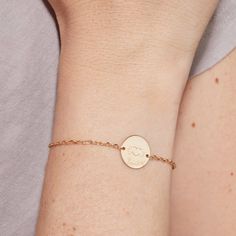 Carry a piece of their heart wherever you go with our Merci Maman x Mellipou Personalized Pastille Chain Bracelet. This timeless bracelet features an engraved Mellipou logo and the hand-engraved names and birth dates of loved ones for a mom to wear and adore. Each bracelet makes a perfect gift for a special mom to treasure.&nbsp;18K Champagne Gold Plated, 925 Sterling Silver or 18K Rose Gold PlatedChain length: 7, adjustable to 6.3Pastille charm: 0.6 x 0.6Engraved by hand in our workshopSent Hand Stamped Heart Jewelry For Friendship, Personalized Round Name Bracelet For Anniversary, Anniversary Name Bracelet With Engraving Option, Personalized Adjustable Classic Heart Bracelet, Minimalist Hand Stamped Name Bracelet For Friendship, Classic Adjustable Personalized Heart Bracelet, Elegant Engraved Heart Name Bracelet, Engraved Sterling Silver Name Bracelet, Engraved Jewelry For Mother's Day And Friendship