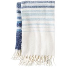 a blue and white striped towel with fringes