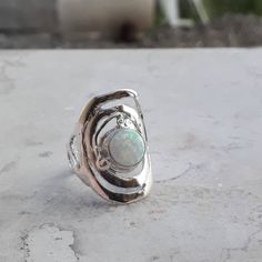 Great comfortable fit White opal silver ring, Statement ring for women inspired by the harmony that exists in spring. Gift for women, holiday accessories, Gift for mom. Boho ring made of sterling silver 925. Looking like a drop of water that fell from the sky and landed in a puddle, it's the most magical harmony in nature. Material: Sterling silver Gemstone: White opal stone. Size to order: 5-16 U.S 🔸 All my creations made by me from Fine Materials, Gemstones, high quality. 🔸 Unique Technique Silver Opal Crystal Ring For Promise, White Opal Open Ring, Spiritual Silver Opal Ring Birthstone, Silver Spiritual Opal Birthstone Ring, Unique Silver Opal Promise Ring, Unique White Opal Ring, Silver Round Opal Ring, Silver Opal Ring Gift, Harmony In Nature