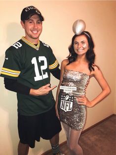 a man and woman dressed up as football players