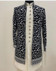 a black and white jacket with buttons on it