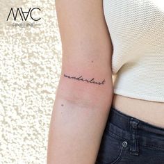 a woman's arm with the word wander written in cursive writing on it