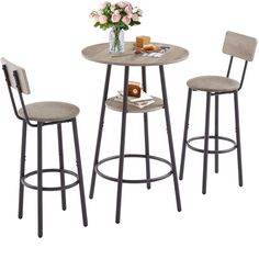 three stools and a table with flowers on it