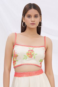 Ivory crop top with all-over multi-color floral motif resham-sequin work and tassel tie-up back.
Component: 1
Embroidered
Neckline: Round
Sleeve Length: Sleeveless
Fabric: Dupion Silk
Color: White
Spaghetti straps
Tassel tie-up back
Note: Pant worn by the model is not for sale - Aza Fashions Crop Top For Women, White Spaghetti, White Spaghetti Strap, Crop Tops Online, Crop Top Women, Embroidered Crop Tops, Dupion Silk, Embroidered Neckline, Silk Embroidery