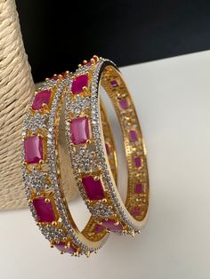 Traditional Bangles comes in set of 4Color : GoldSize : Size : 2.4Stones : AD Red Stones Ad Bangles Set, Luxury Traditional Ruby Bracelets, Luxury Ruby Bangle As A Gift, Luxury Red Hand Set Bangle, Traditional Bangles, Red Bangles, Red Stones, American Diamond, Bangle Set