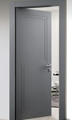 an open gray door in a white room