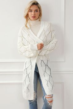 White V-neck Sweater Coat For Winter, White Knitted Acrylic Outerwear, Knitted Acrylic V-neck Sweater Coat, White Acrylic Sweater Coat For Fall, White Long Sleeve Acrylic Cardigan, White Acrylic Outerwear For Spring, Cable Knit Acrylic Outerwear, Cozy Fitted Acrylic Cardigan, White Textured Knit Winter Outerwear