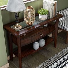 a wooden table with two lamps on top of it next to a chair and window