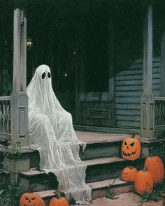 a ghost sitting on the steps with pumpkins