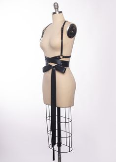 High quality, durable-yet-delicate bespoke harness made in leather or vegan leather. Embellished with tassels. Luxurious wide satin ribbons wrap around the waist and tie into a bow. Choose from gold or silver toned nickel plated steel hardware. Shown in black leather/gold ribbon/gold hardware and black leather/black ribbon/silver hardware. Custom sizing available. All pieces are MADE TO ORDER, standard sizes XS-4XL. If your measurements fall outside these standards or you are unsure of what size Seattle Fashion, Satin Ribbons, Ribbon Belt, Ribbon Wrap, Vintage Gothic, Gold Ribbon, Gold Ribbons, Black Ribbon, Satin Ribbon