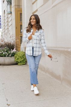 Upgrade your layering game with our Navy Plaid Shacket! This versatile piece features a classic collared neckline, button down front, and chest pockets. Keep warm with the long sleeve design and elevate any outfit with the allover plaid pattern. Perfect for effortless and stylish layering. Layer it over a basic long sleeve top, jeans, and comfy sneakers for a chic everyday outfit!