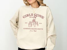 Relax and celebrate in style with our Custom Girls Gone Mild Bachelorette Sweatshirt! Perfect for a laid-back bachelorette party, this cozy sweatshirt is ideal for those chill nights in with your bridal squad. Whether you're planning a spa day, a PJs and Prosecco party, or a sleepover bachelorette, this personalized sweatshirt brings comfort and fun to your celebration. Crafted from quality fabric, this sweatshirt is both soft and durable, ensuring you and your friends can relax in style. Customize it with names, dates, and locations to make it the perfect keepsake for your chill bachelorette party. Whether it's for lounging or a casual get-together, this sweatshirt is sure to make lasting memories. >>PLACING AN ORDER<< select the STYLE+SIZE & COLOR followed by the size (PLEASE NOTE: these Bachelorette Pjs And Prosecco, Pjs & Prosecco Bachelorette, Casual Crew Neck T-shirt For Bachelorette Party, Custom Bachelorette Sweatshirts, Spring Crew Neck T-shirt For Bachelorette Party, Bridal Squad, Bach Party, Bachelorette Shirts, Bachelorette Gifts