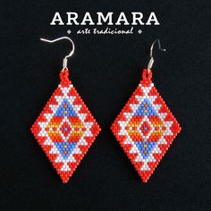 ** Dimensions ** Length 2.83 inches (7.2 cms) Width 1.29 inches (3.3 cms) ** General Description ** Elevate your style with these exquisite Huichol earrings, handcrafted by indigenous artisans from Mexico. These earrings are a testament to the intricate beadwork, vibrant colors, and traditional Huichol motifs inspired by nature and ancient cultural symbols. Made with meticulous attention to detail, these Mexican earrings are not just accessories but pieces of art that carry a rich cultural heritage. With their striking design, these Huichol earrings are guaranteed to turn heads and elicit compliments wherever you go. Whether you're attending a special event or adding a touch of elegance to your everyday look, these earrings are sure to make a statement and spark conversations about the bea Southwestern Beaded Earrings As Gift, Southwestern Style Beaded Earrings As Gift, Southwestern Style Beaded Earrings For Gift, Red Southwestern Style Earrings For Festivals, Southwestern Red Earrings For Festival, Southwestern Style White Earrings For Festivals, Southwestern Style Red Earrings For Festival, Handmade Southwestern Drop Earrings, Southwestern Red Beaded Earrings As Gift