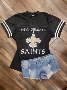 New Orleans Saints Glitter Jersey Black Glitter Print Tops For Cheerleading, Sporty Glitter Print T-shirt For Sports, Glitter Print Tops For Sports Events And Season, Black T-shirt For Game Day In Summer, Black Cheerleading Tops For Summer, Black Tops For Cheerleading In Summer, Black Tops For Summer Cheerleading, Casual T-shirt With Glitter Print For Sports Events, Black Glitter Print Top For Summer