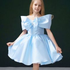 This elegant DreamyVow satin dress features delicate beadwork and a beautiful bow detail, perfect for any flower girl. The knee-length design adds a touch of sophistication, making your little one look like a princess. Crafted in a stunning shade of blue, this dress is sure to make her stand out on your special day. Beaded Flower Girl Dress, Yellow Evening Dresses, Silver Evening Dress, Purple Evening Dress, Flower Girl Dresses Blue, Gold Evening Dresses, Green Evening Dress, Girls Dress Shop, Pink Evening Dress