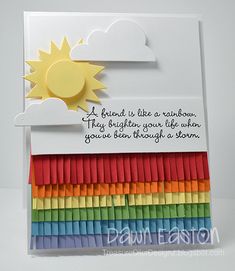 a card with the words, a friend is like a rainbow that brightens your life when you're left through it too