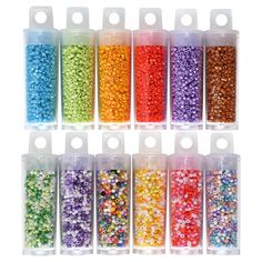 six plastic containers filled with different colored beads