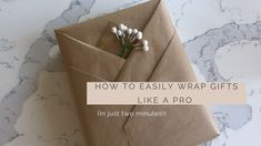 an envelope with flowers in it and the words how to easily wrap gifts like a pro