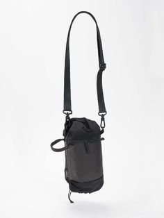 This wearable pouch is designed to be worn both vertically and horizontally. A playful twist in the material at the ends of the bag hide the various carrying loops. A central compartment offers optimal storage options for your everyday carrying needs while the side pocket can be used to store a small drink bottle. The MINI DUFFLE comes with a carry strap but can also be directly clipped onto a bigger bag or be worn in combination with an ADDA. Functional Bags With Water Bottle Pocket For Outdoor, Functional Bags With Water Bottle Pocket For Outdoor Activities, Functional Outdoor Bags With Water Bottle Pocket, Functional Nylon Shoulder Bag With Water Bottle Pocket, Versatile Bags With Water Bottle Pocket For Outdoor Activities, Black Shoulder Bag With Water Bottle Pocket For Outdoor, Versatile Bag With Water Bottle Pocket For Outdoor Activities, Versatile Bags For Outdoor Activities With Water Bottle Pocket, Outdoor Activities Bag With Water Bottle Pocket