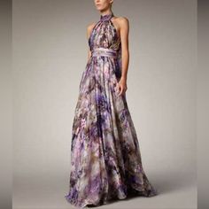 New Badgley Mischka Collection High Neck Floral Gown - Florals And Painterly Prints - Halter Neck Gown - Strapless Cascading Peplum Dress - Shell: 100% Silk - Lilac - Size 2 Purple Floor-length Gown For Prom, Glamorous Floral Print Maxi Dress For Wedding, Purple Fitted Maxi Dress For Wedding Guest, Fitted Purple Maxi Dress For Wedding Guest, Purple Maxi Length Prom Dresses, Spring Purple Floor-length Evening Dress, Summer Wedding Guest Purple Maxi Dress, Lavender Evening Dress For Gala And Prom Season, Purple Sleeveless Maxi Dress For Prom