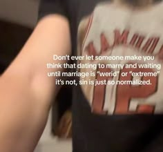 a person wearing a t - shirt that says don't ever let someone make you think that dating to marry and waiting until marriage is weird or extreme it's not,