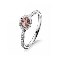 an engagement ring with a pink diamond in the center and white diamonds on the sides