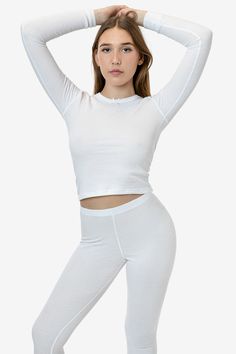 This thermal long sleeve top is an essential layering piece for the winter. Made of our 50/50 poly cotton waffle knit that keeps you comfortably warm and cozy. Features a delicate bow at the neckline, ribbed wrist cuffs and finished with durable flatlock seams. Try pairing with our matching T3280 Baby Thermal Leggings for a cute sleep or loungewear look. Runs true to size. Made in Los Angeles, Calif. Our experienced sewers earn up to $25 an hour and no less than $17.25; additionally workers have Cute Sleep, Bus Pass, Thermal Leggings, Thermal Long Sleeve, Wrist Cuffs, Waffle Knit, Layering Pieces, 50 50, The Winter