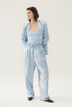 Combining our love for silk with twill cotton, the Silk Twill Slouch Pants are a modern take on an 80s classic. With an elastic waistband, pleated front, and internal lining, our latest design introduces pants to be worn every day, no matter the occasion. Dress it up with our Boyfriend Shirts, or keep it casual with a Summer Parachute Pants With Elastic Waistband And Tapered Leg, Summer Silk Straight Leg Bottoms, Summer Silk Straight-leg Bottoms, Chic Cotton Parachute Pants With Tapered Leg, Spring Tapered Bottoms With Elastic Waistband, Tapered Bottoms With Elastic Waistband For Spring, Linen Tapered Leg Pants For Daywear, Casual Silk Bottoms With Relaxed Fit, Chic Tapered Leg Loungewear Pants